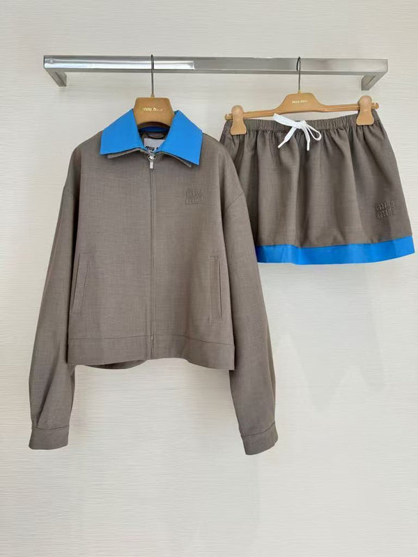 New for early fall, this lapel-embroidered, color-blocked jacket and skirt pair.