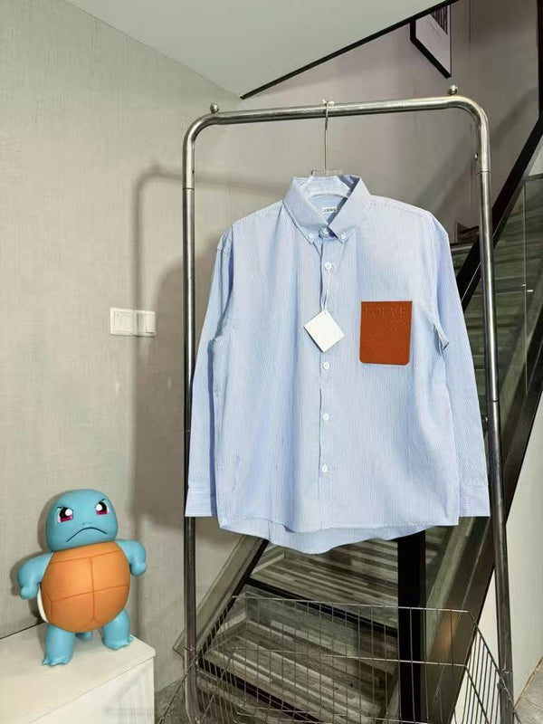 Striped shirt with a leather patch on the chest pocket